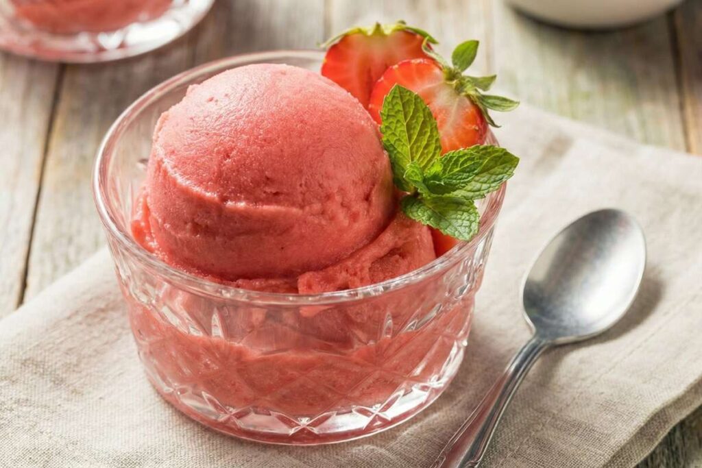 Strawberry banana sorbet in glass bowl, healthy dairy-free frozen dessert